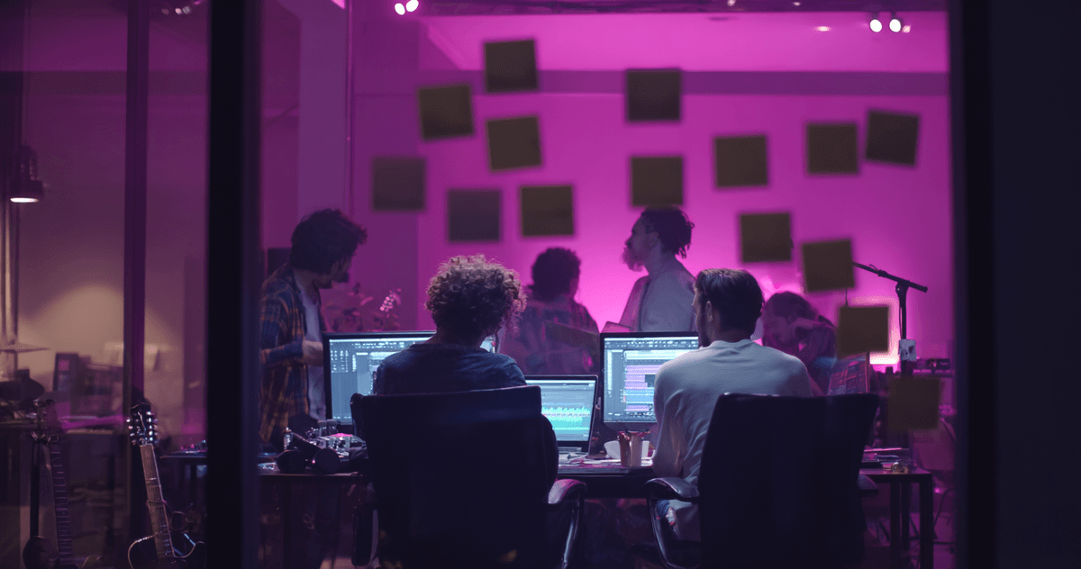 Female music producer working on lyric changes in professional studio