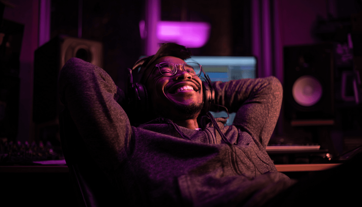 Happy music producer celebrating successful lyric swap